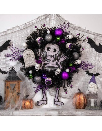 24 in. Purple and Black Unlit Spooky Skeleton Pine Halloween Wreath